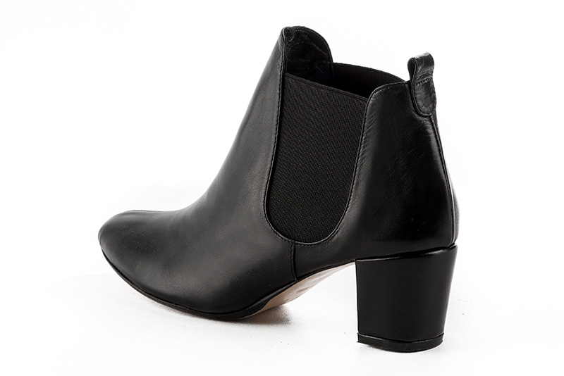 Satin black women's ankle boots, with elastics. Round toe. Medium block heels. Rear view - Florence KOOIJMAN